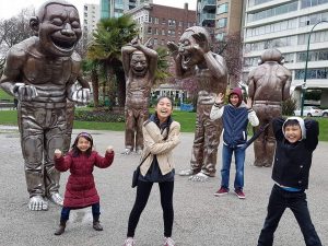 Having fun in a rainy day at English Bay